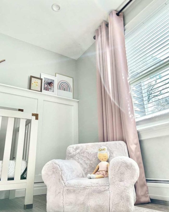 White Paneling Anchors Soft Pink Nursery