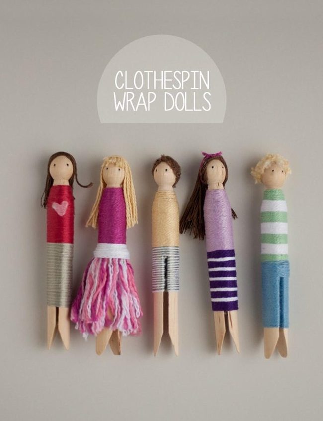 Wooden Dolls In Colorful Yarn