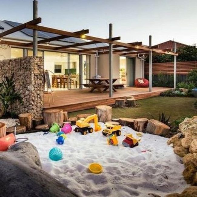Colorful Sandbox Under Pergola Lights