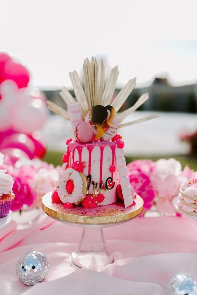 Pink Frosting Cake With Gold Stands
