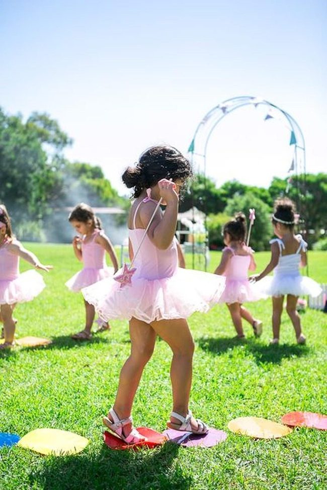 Pink Tutus Dancing On Grass