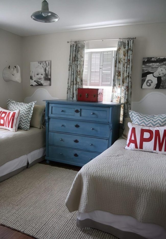 Blue Dresser Between Beige Beds