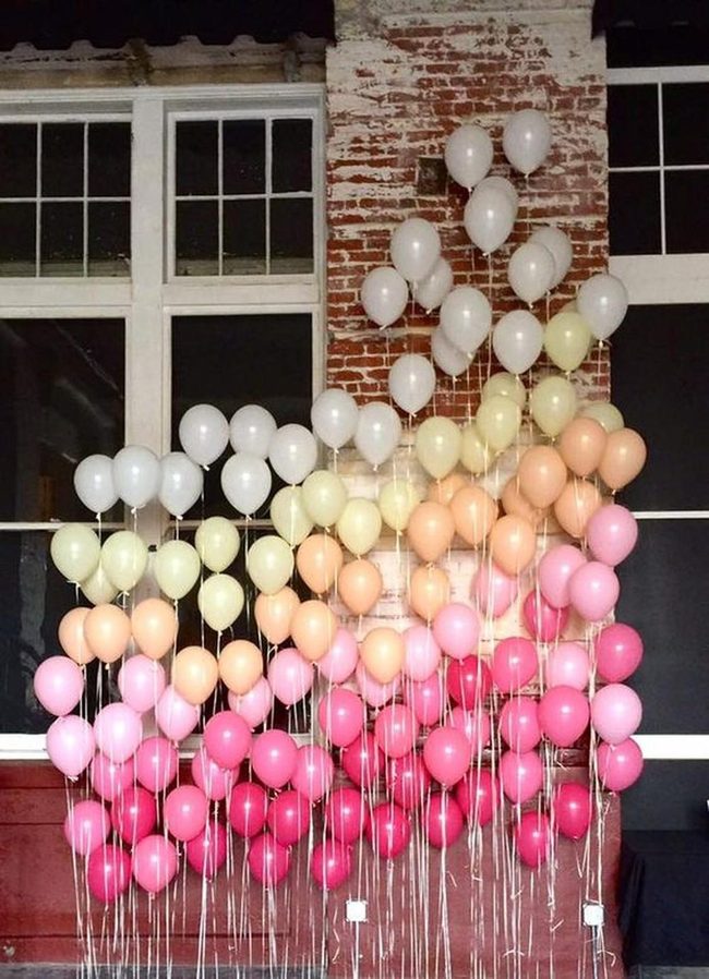 Pastel Balloons Against Brick
