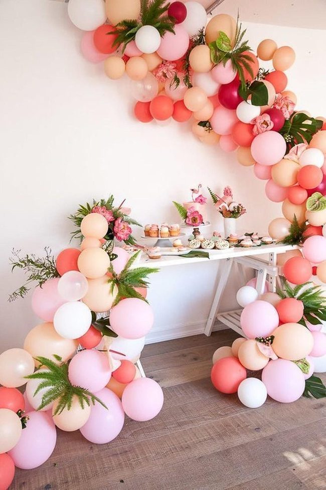 Pink Balloons, Greenery, And Blooms