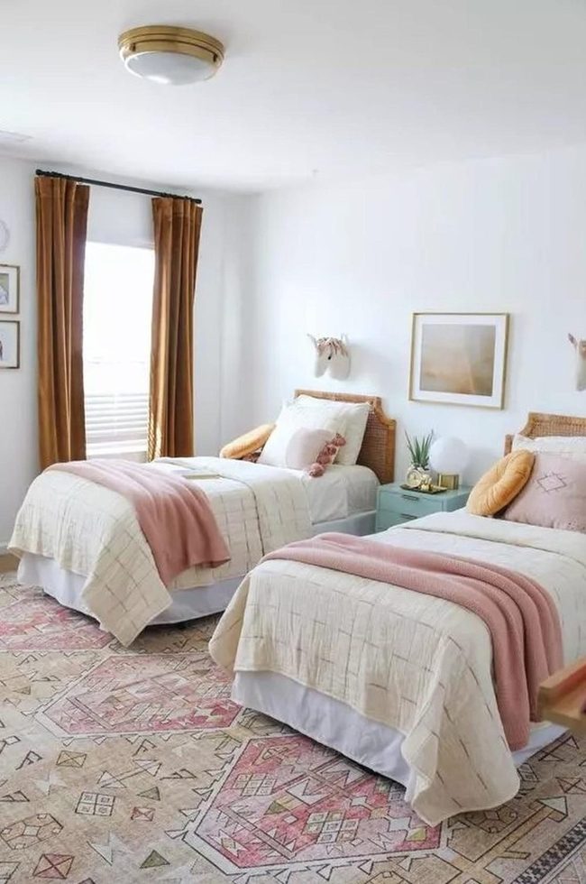 Cream Walls, Pink Throws, Blue Nightstands
