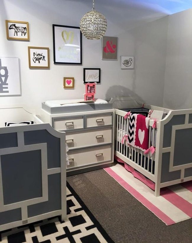 Pink Chandelier Nursery With Striped Patterns