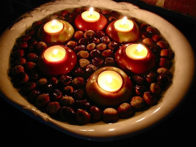 Crimson Candleholders With Scattered Chestnuts