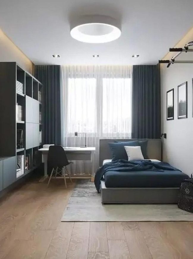 Dark Blue Bedroom With Wood Floors