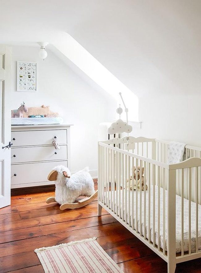 White Nursery With Natural Wood Floors