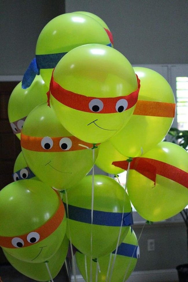 Green Balloons With Playful Paper Masks
