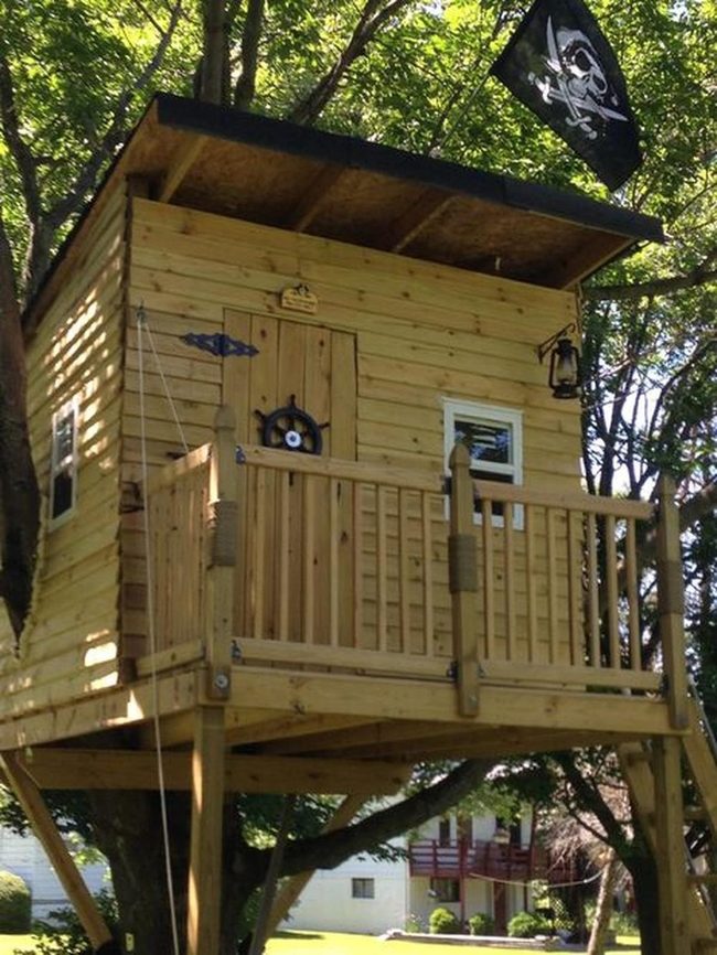 Wooden Treehouse With Pirate Flag