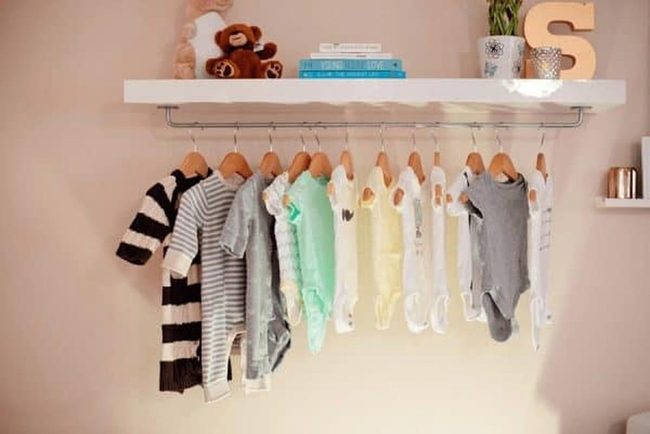 Baby Clothes Display On Floating Shelf