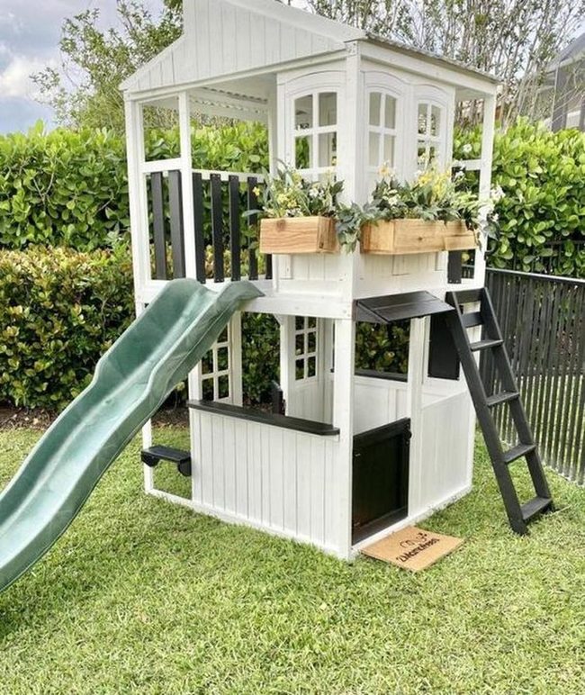 White Playhouse With Green Slide