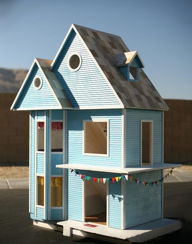 Light Blue Cottage With Round Windows
