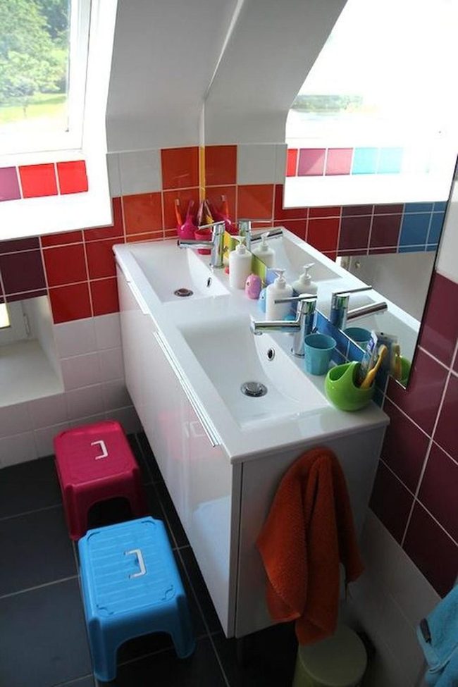 Crimson Tiles And Rainbow Accents Bathroom
