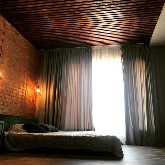 Raw Brick Attic Bedroom