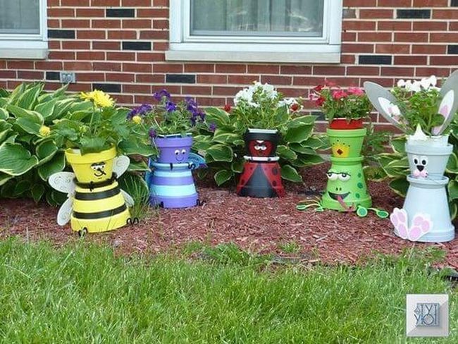 Whimsical Bug Pots Among Blooms