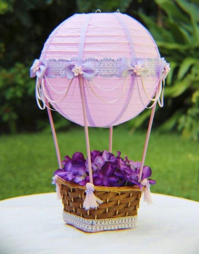 Purple Flowers In Woven Basket