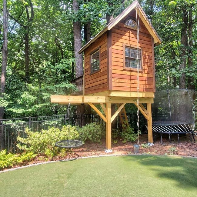Wooden Treehouse With Hanging Swing