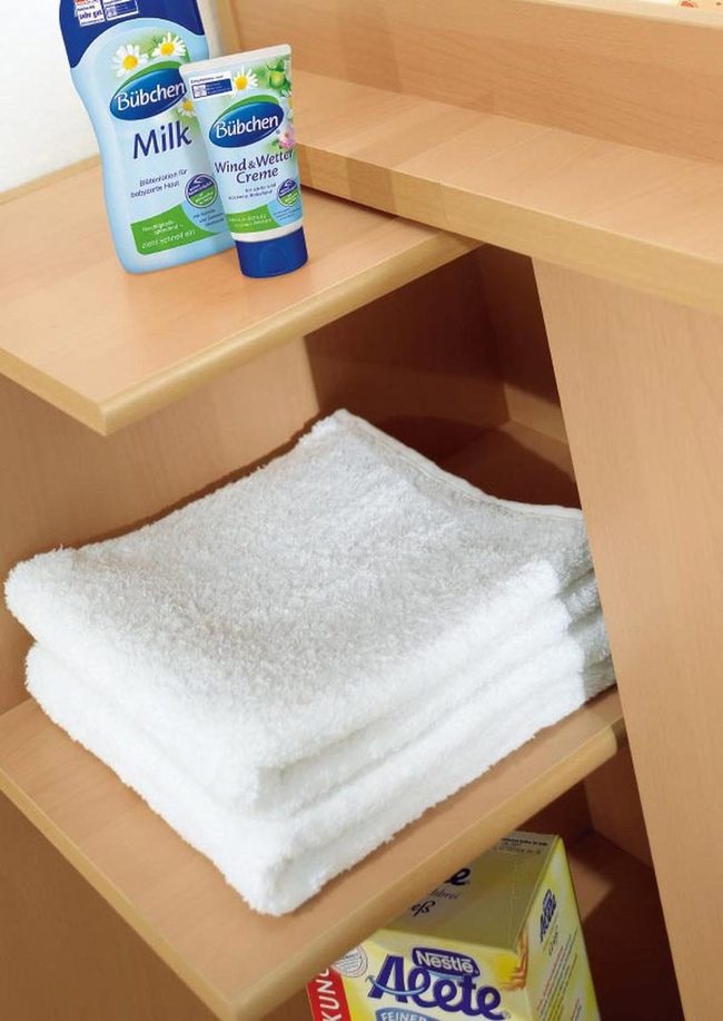 White Towels On Wooden Shelves