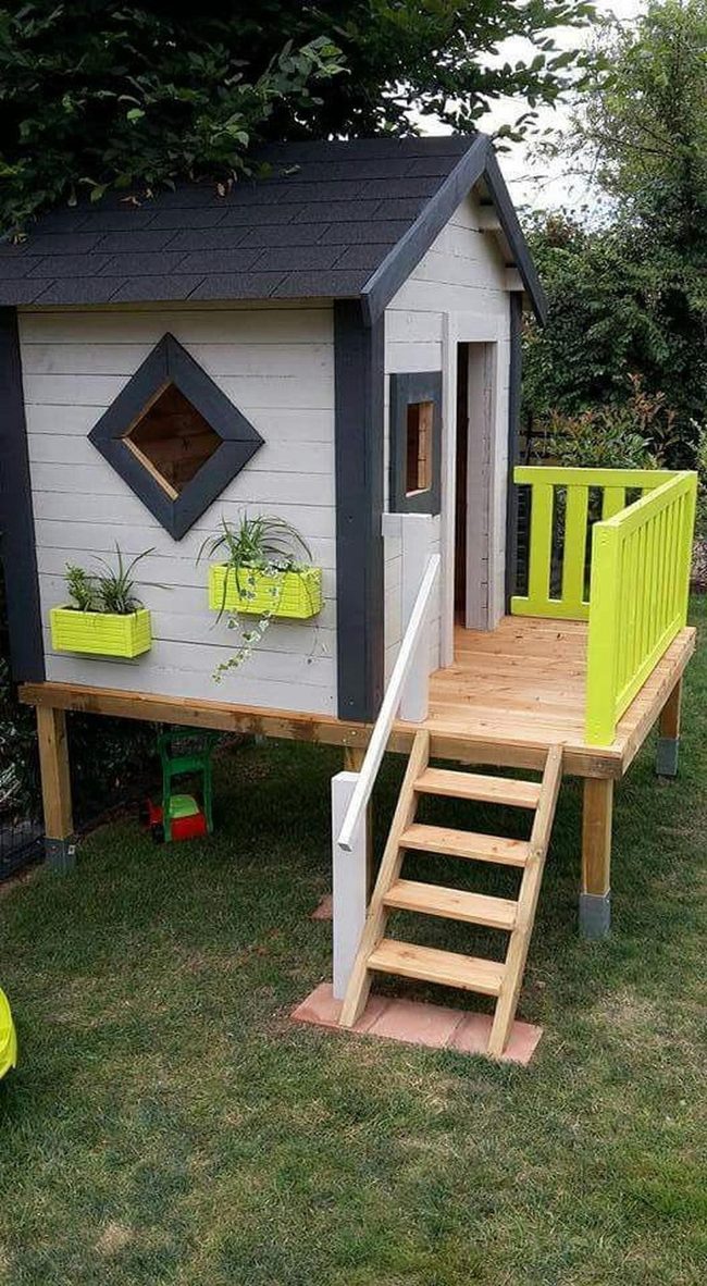 Elevated Playhouse With Yellow Flowers