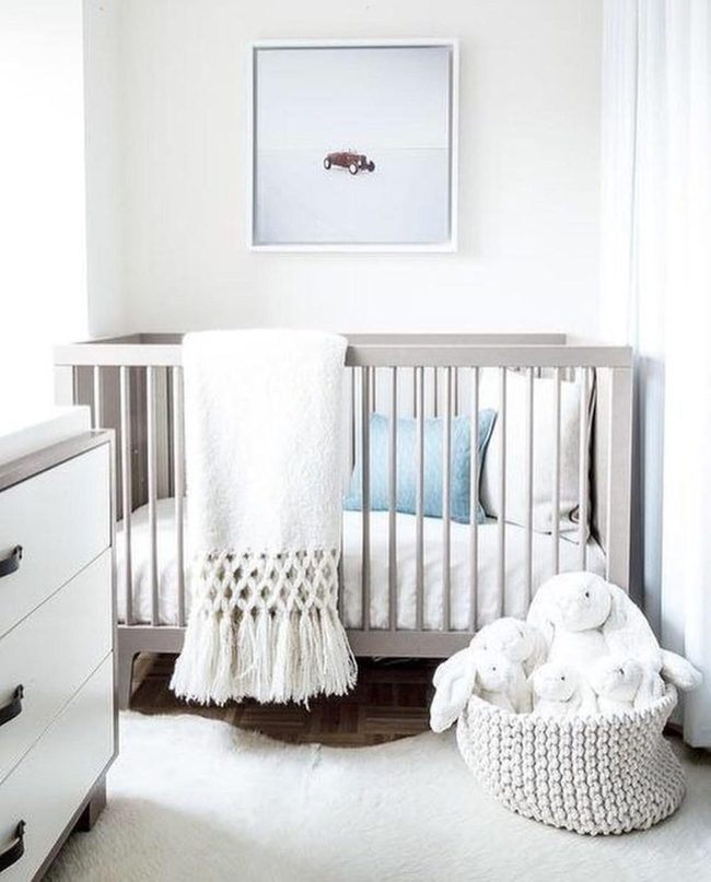 Gray Nursery With Blue Pillow Accent
