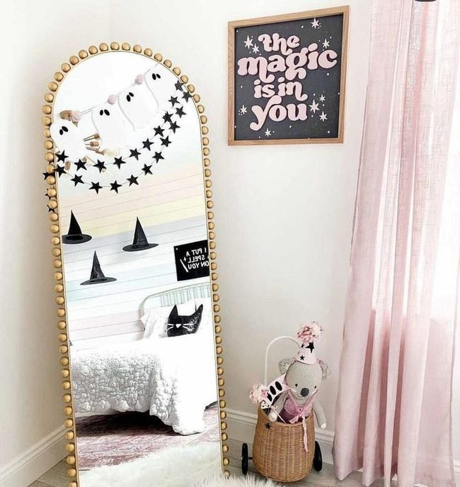 Pink Sunlit Bedroom With Beaded Mirror