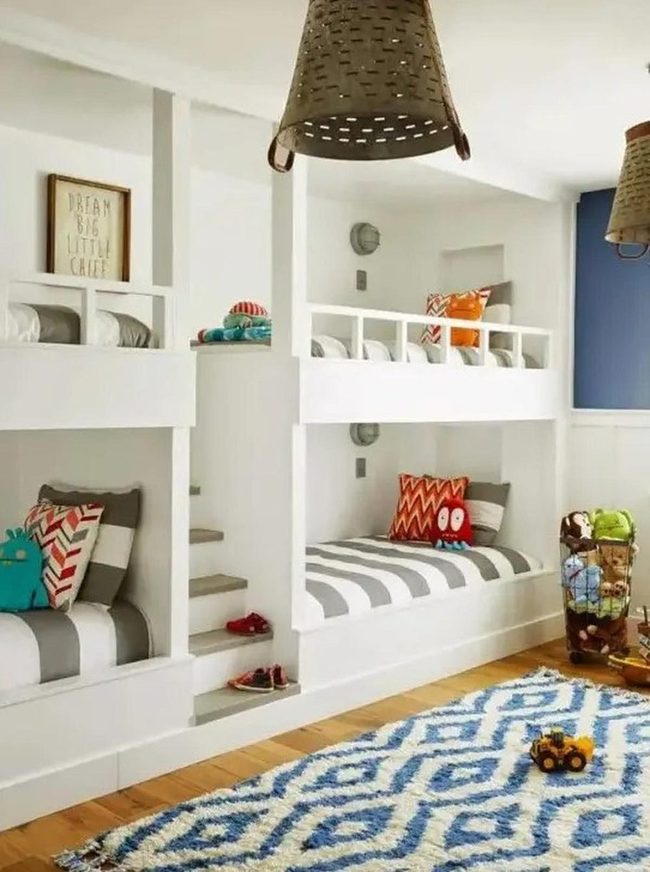 White Bunks, Striped Bedding, Blue Rugs