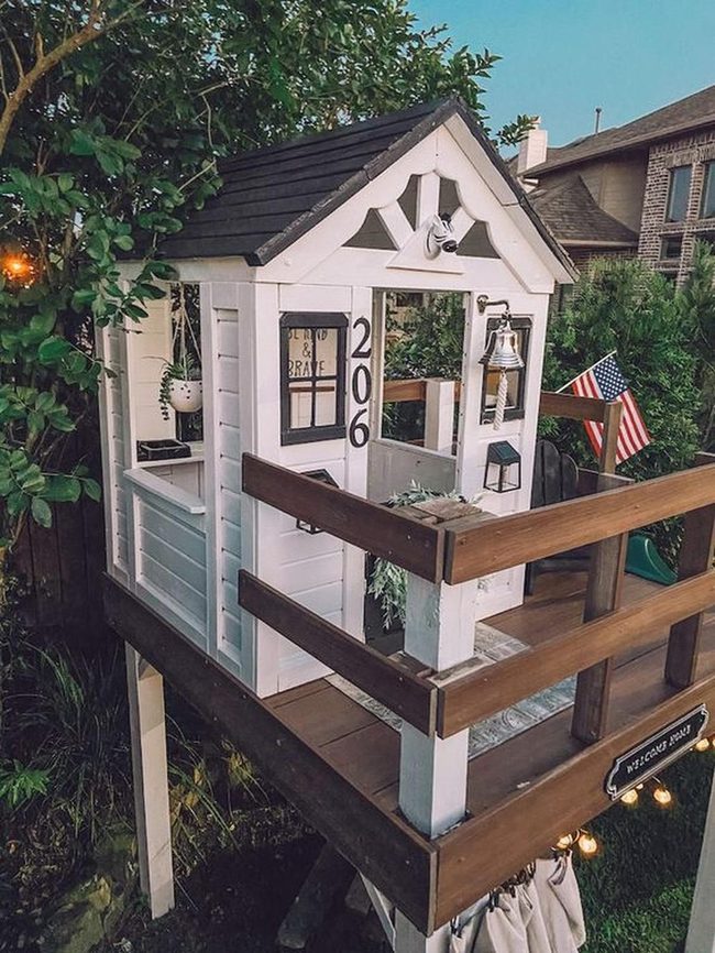 White Cottage With Warm String Lights