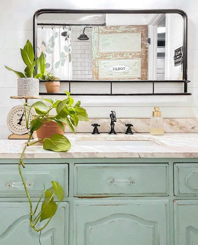 Green Marble Bathroom With Black Mirror