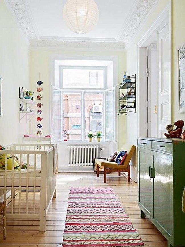 Sunlit Yellow Nursery With Striped Rug