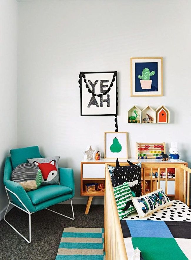 Teal Chair With Colorful Animal Pillows