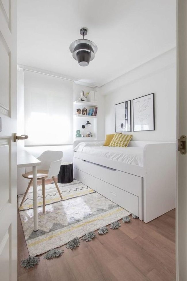 Sunlit White Bedroom With Patterned Rug