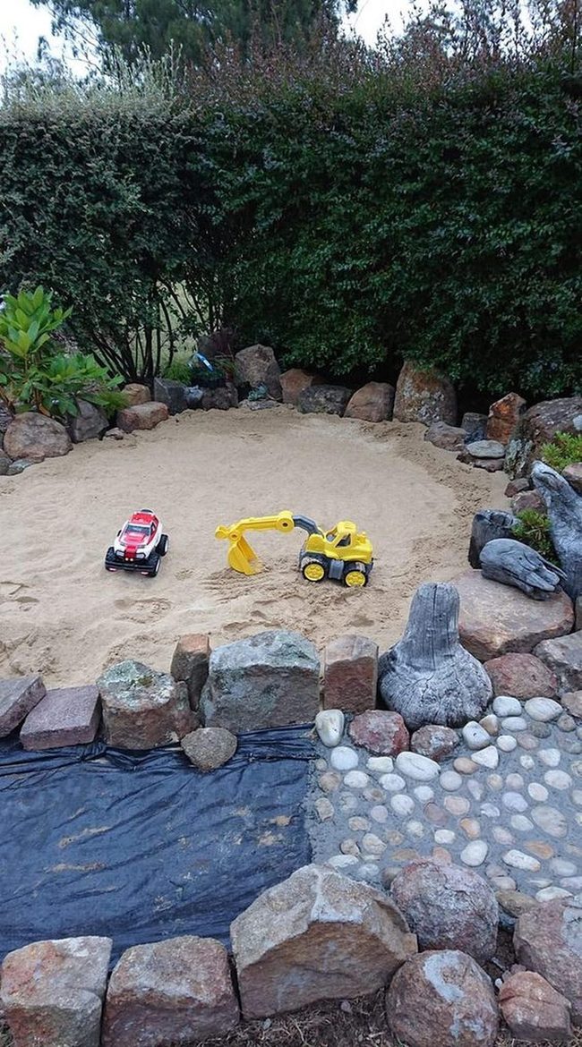 Sand, Stones, Bright Vehicles