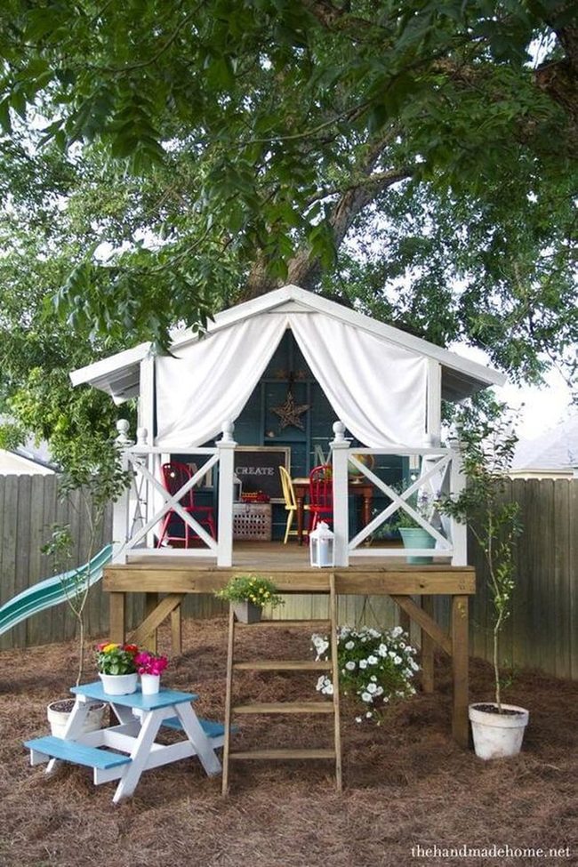 Wooden Treehouse With White Curtains