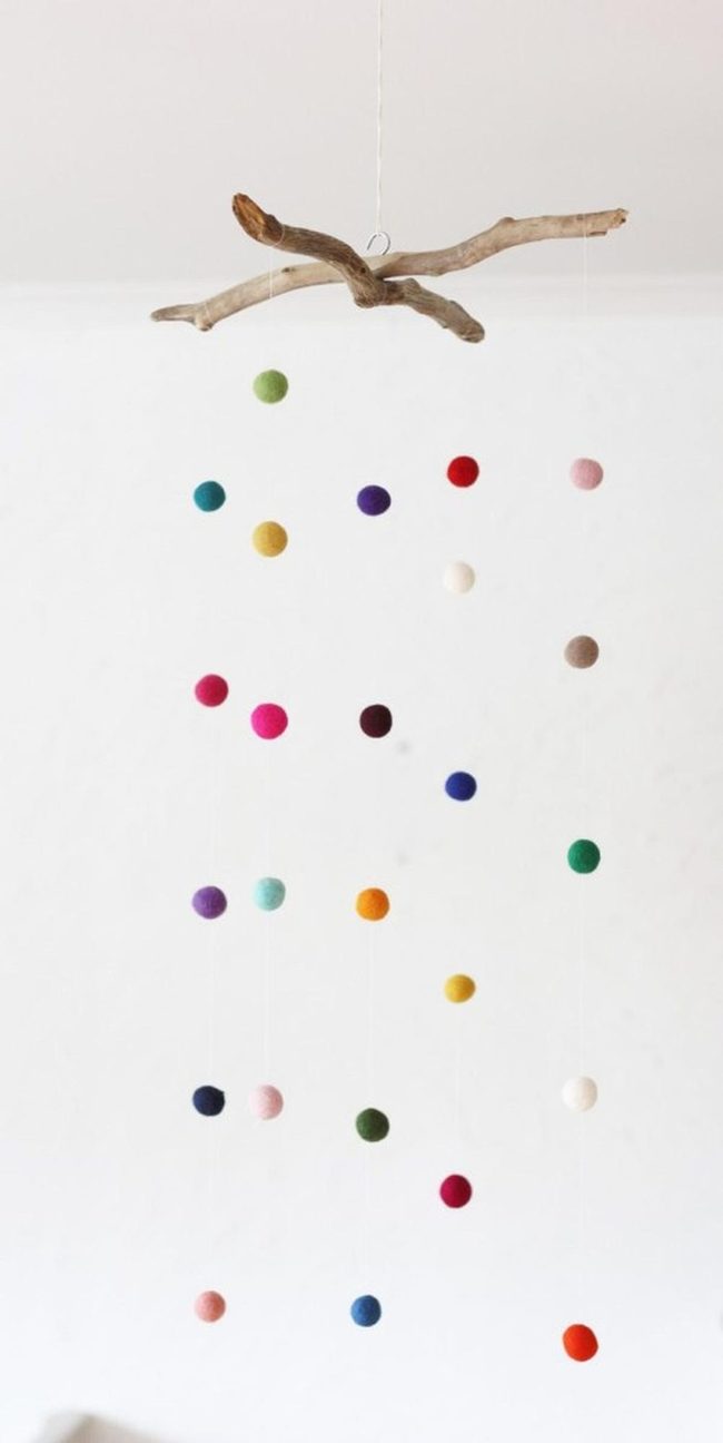 Colorful Felt Spheres On Driftwood