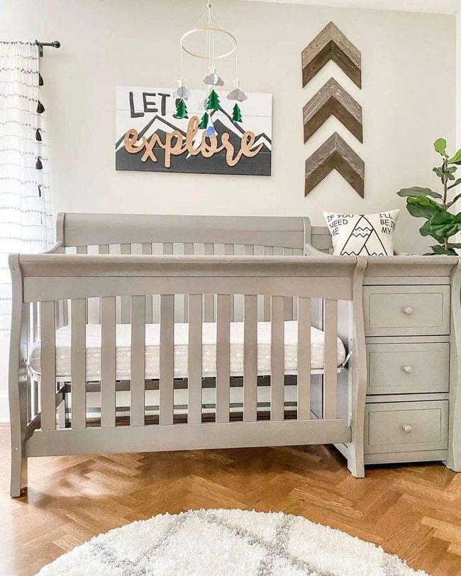 Gray Crib, Wooden Walls, Soft Rugs