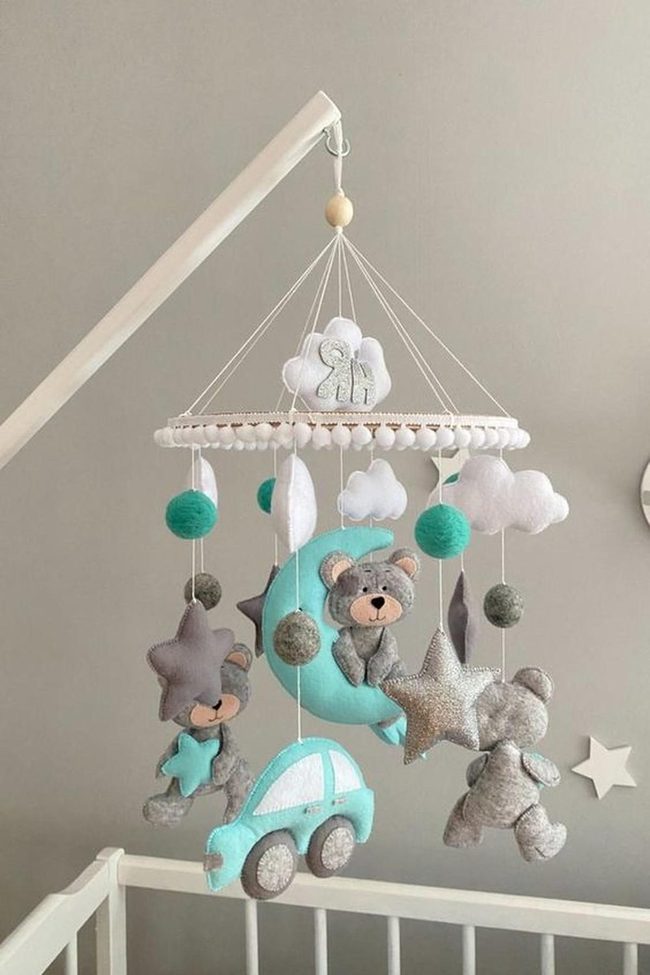 Turquoise Car Among Soft Felt Clouds