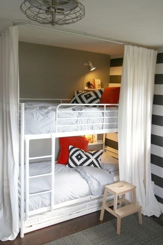 Red Pillows, Striped Walls, Metal Bunks