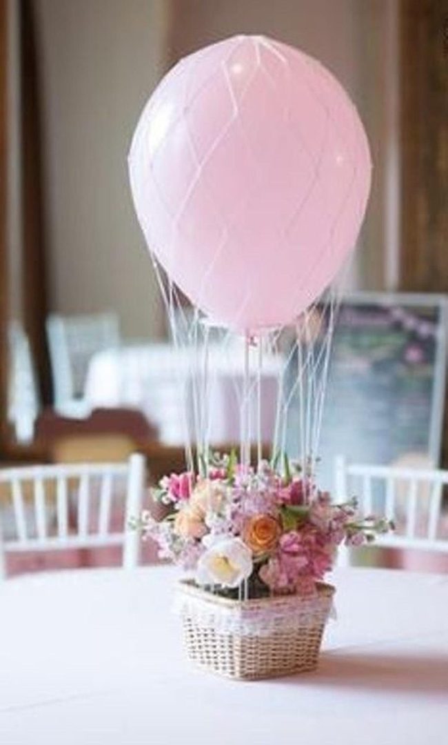 Pink Balloons Above Flower Baskets
