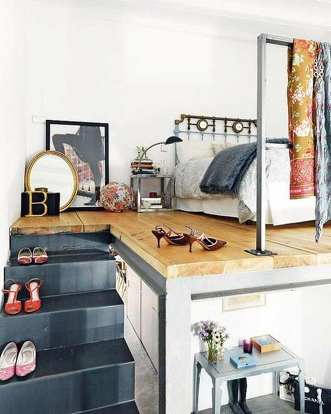 Wooden Platform Bedroom With Brass Accents