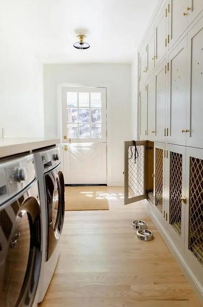 Sunlit Laundry Room With Wood And White
