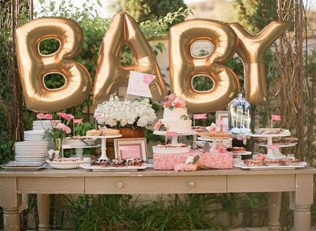 Golden Balloons Over Pink Pastries