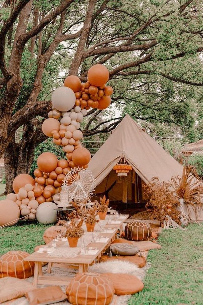 Beige Tent Among Towering Greens
