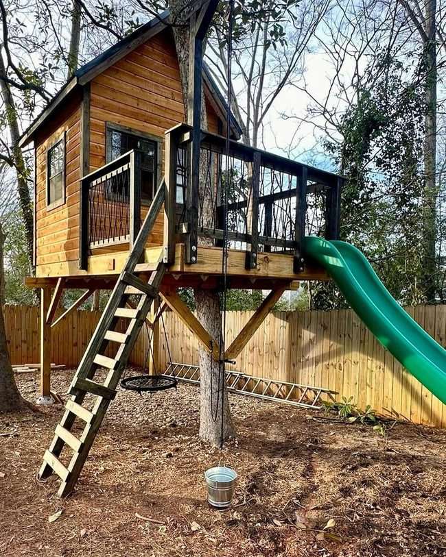 Wooden Treehouse With Slide