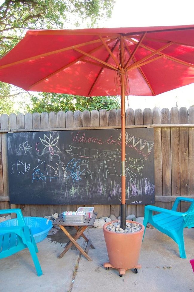 Blue Chairs, Red Umbrella, Concrete Canvas