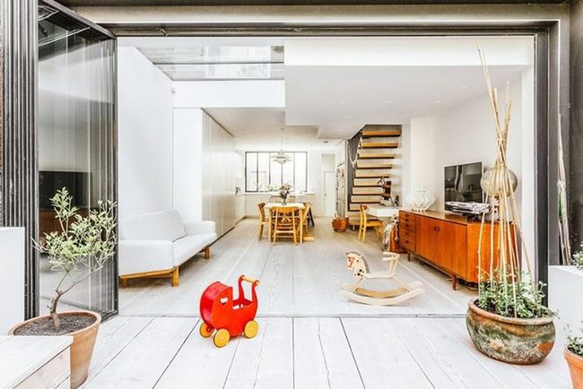 Glass Accordion Doors Expand Living Space