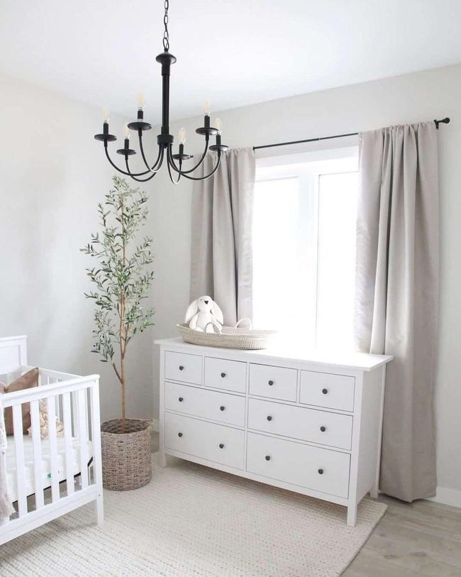 Black Chandelier Transforms Minimal Nursery