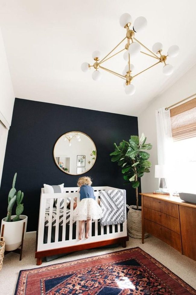 Navy Walls, Gold Chandeliers, Calm Nursery