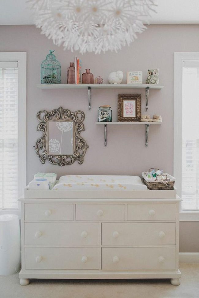Gray nursery with ornate mirror light
